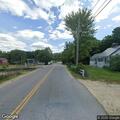 Low hanging wires across road and into yard