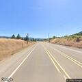 Traffic stop with silver sedan on rural bypass