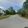 Officer checks vehicle on back road in Athol
