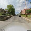 Suspicious person trying to enter house on Main Street