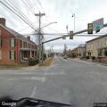 Motorcycle rider seen without lights or helmet
