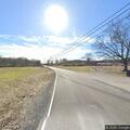 Traffic stop on dark GMC pickup at intersection
