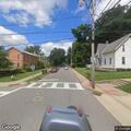 Parking violation involving white Genesis sedan