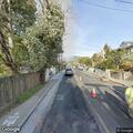 Car drives onto curb on East Blithedale Avenue