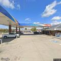 Driver reported unable to maintain lane near gas station