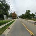 Speeding red vehicle on Spring Arbor Road