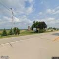 Logging truck knocks down highway signs at intersection