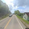 Vehicle crash near creek injures elderly driver