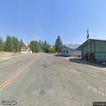 Smoldering campfire log extinguished at campground