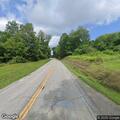 Truck leaves roadway after swerving to avoid deer