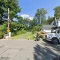 Man walking dog off leash in neighborhood