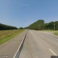Wood debris blocking lane on Highway 210