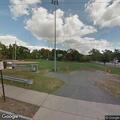 Vehicle with loud muffler in parking lot