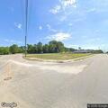 Female stopped beside road in blue Dodge Challenger