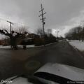Large tree blocking part of roadway at intersection