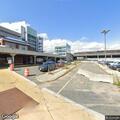Woman experiencing stomach pain at Wonderland station
