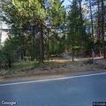 Small fire in wood pile near Nevada City road