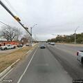 Train stopped and crossing arms down at intersection
