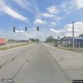 Officer conducts traffic stop on silver Ford