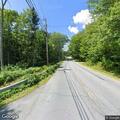 Tree on power wires burning over roadway