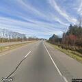 Officer checks for car driving without headlights