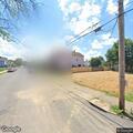 Wire hanging over roadway on Sixth Street