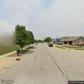 Low hanging phone lines behind Amber Way address