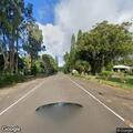 Large boulder blocking southbound lane in Hawi