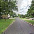 Caller reports neighbor harassment on East Second