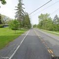 Power line down in driveway on West Genesee Street