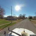 Suspicious small car parked in grass on Locust Street