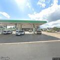 Male subject having difficulty breathing at gas station