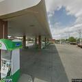 Disabled car with flat tire near Circle K
