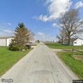 Unoccupied gray vehicle reported at rural address