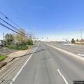 Red sedan hits center divider on Calvine Road