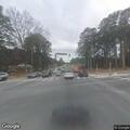 Bus mirror struck by passing pickup at intersection