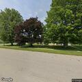 Woman with severe back pain at church in Waucoma