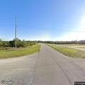 Loose dog running in roadway near Indian Lake