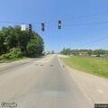 Man unresponsive in construction vehicle cab at intersection