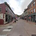 Person locked out of white Subaru on Main Street