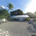 Men try to open door at home in Tavernier