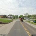 Speeding motorcyclist entering city on Oak Street