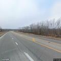 Stalled vehicle with flat tire on Highway 71