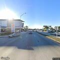 Person with dislocated shoulder in parking lot vehicle