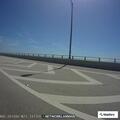 Illegally parked vehicles block lane on causeway