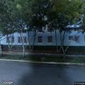 Abandoned blue car checked at apartment complex