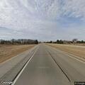 Slow blue Cadillac swerving on I-90 near Stewartville