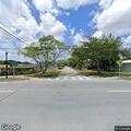 Pedestrian walking in roadway on NE 6th Avenue