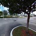 Motorcycle and car crash with injuries in parking lot