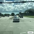 Occupied blue SUV reported on fire in turn lane